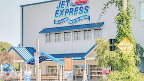 A Jet Express building with a sign for 'The Fastest Way to the Islands'. - Super 8 by Wyndham Port Clinton (Port Clinton)
