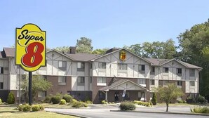 A Super 8 motel with a large sign, a two-story building, and a parking lot. - Super 8 by Wyndham Richmond/Chamberlayne Rd (Richmond)