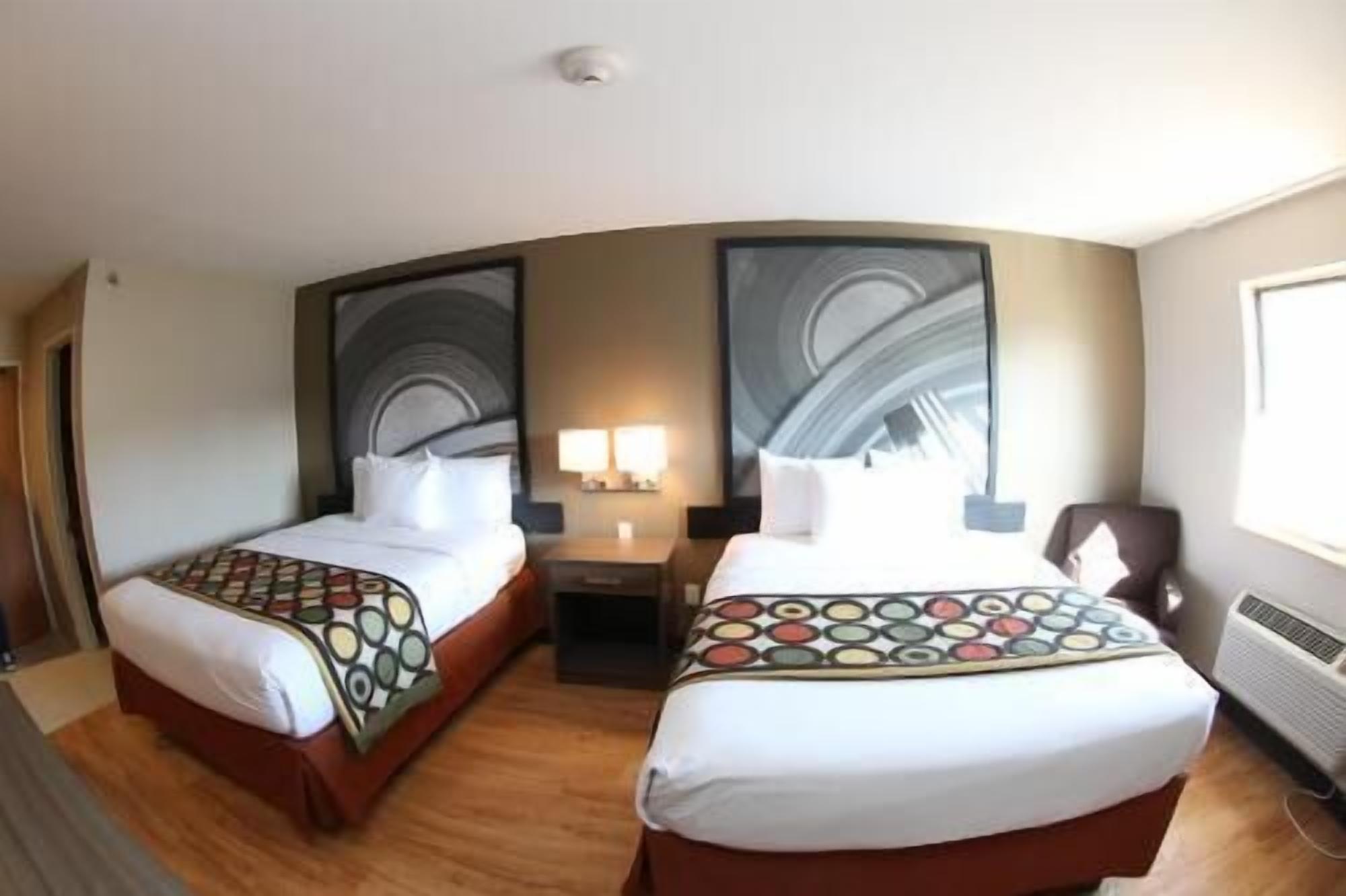 Hypo-allergenic bedding, pillowtop beds, desk, blackout drapes