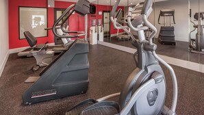 A gym with treadmills, elliptical machines, and a mirrored wall. - Wingate by Wyndham Canton/Hall of Fame (Canton)