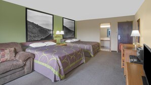 A hotel room with two beds, a sofa, a TV, and a desk. - Super 8 by Wyndham Christiansburg/Blacksburg Area (Christiansburg)