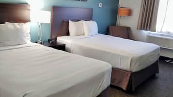 Premium bedding, pillow-top beds, desk, laptop workspace