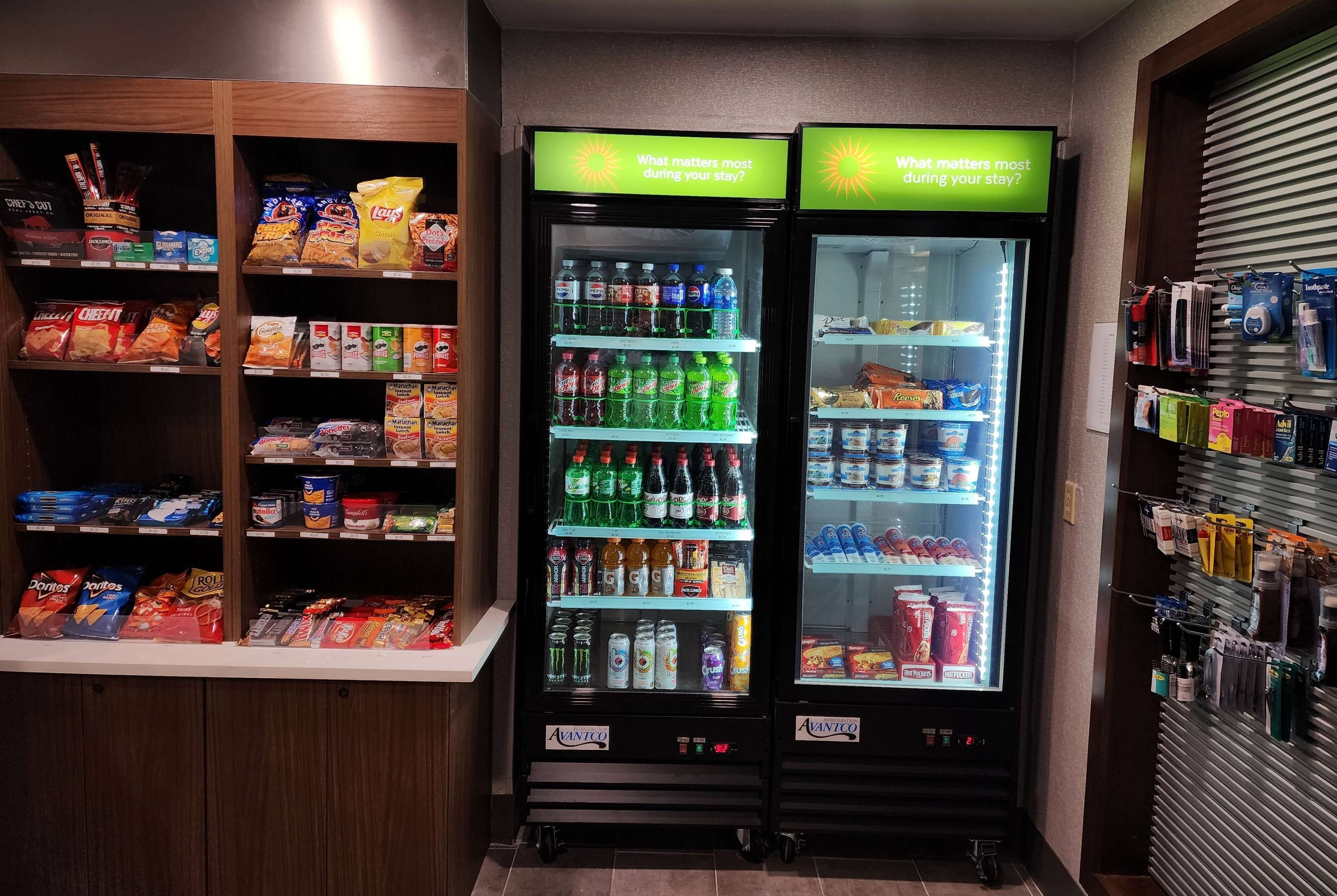A vending area with snack and drink options, including chips, sodas, and bottled water.