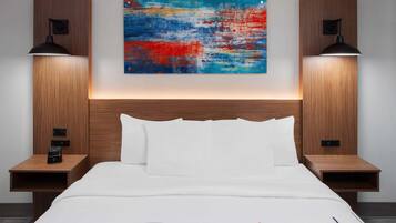 Premium bedding, desk, laptop workspace, iron/ironing board