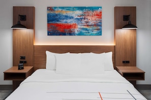 Premium bedding, desk, laptop workspace, iron/ironing board