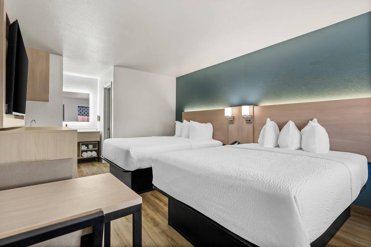 Room, 2 Queen Beds, Non Smoking (Efficiency, Upgrade) | Desk, laptop workspace, free WiFi, bed sheets