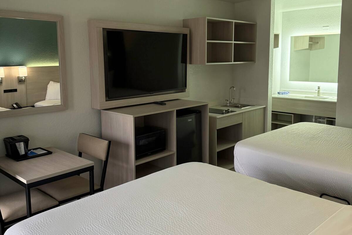 Desk, laptop workspace, free WiFi, bed sheets