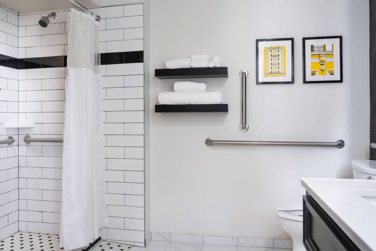 Suite, 1 King Bed, Accessible (Roomy) | Bathroom | Designer toiletries, hair dryer, towels, soap