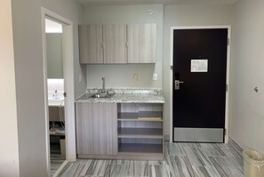 Suite, 1 Queen Bed, Non Smoking | Desk, laptop workspace, blackout curtains, iron/ironing board