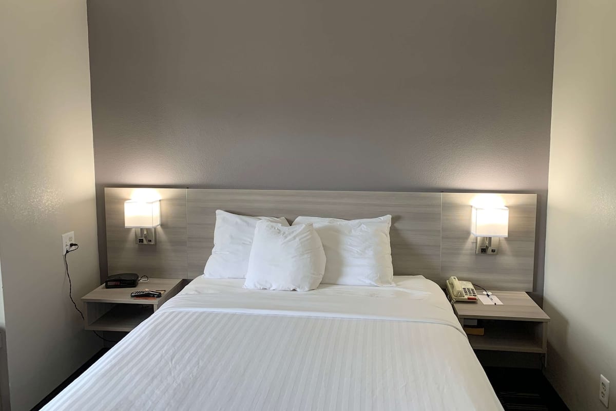 suite, 1 queen bed, non smoking | desk, laptop workspace, blackout curtains, iron/ironing board