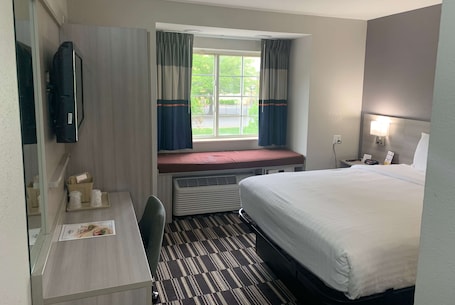 Desk, laptop workspace, blackout curtains, iron/ironing board. Microtel Inn by Wyndham Charlotte Airport