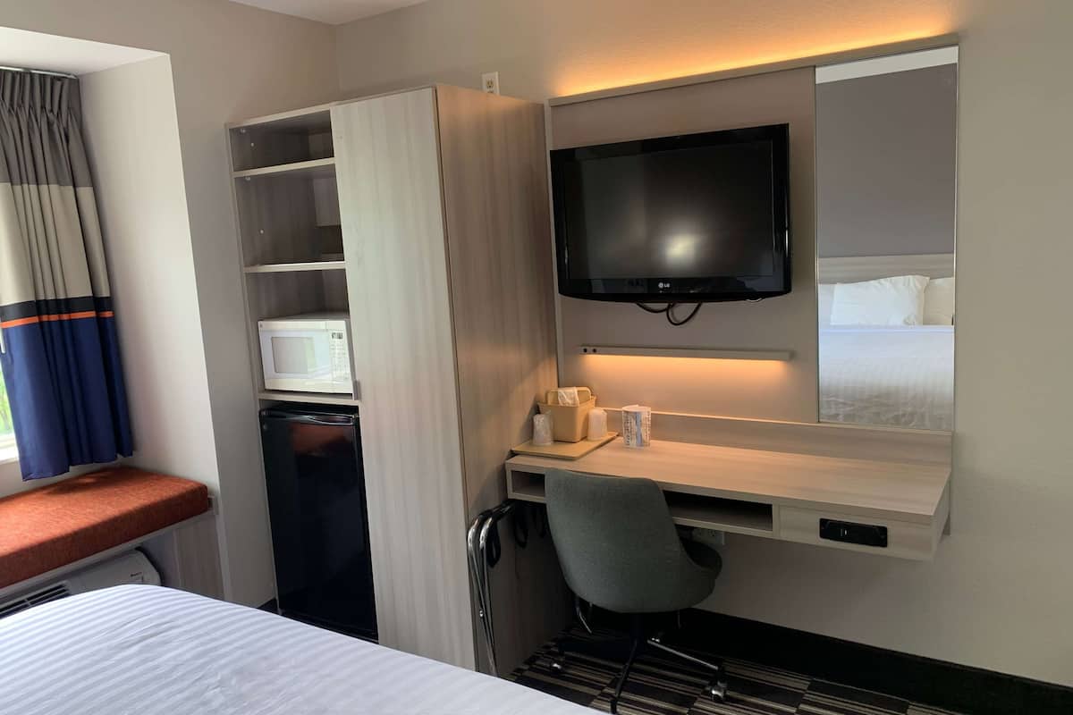 desk, laptop workspace, blackout curtains, iron/ironing board