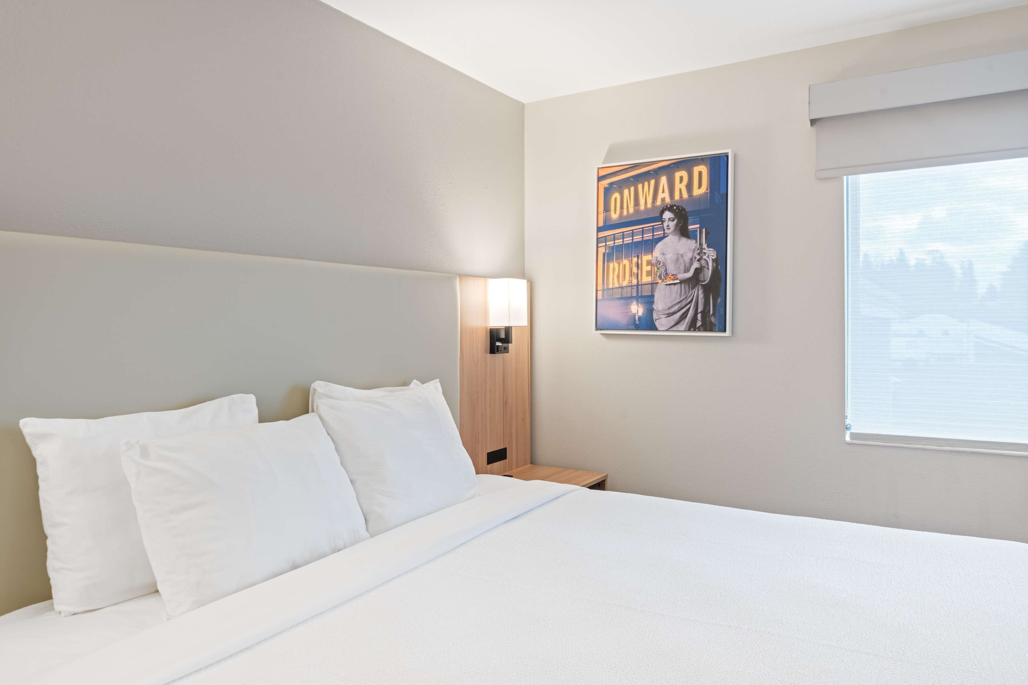 Premium bedding, pillow-top beds, desk, laptop workspace
