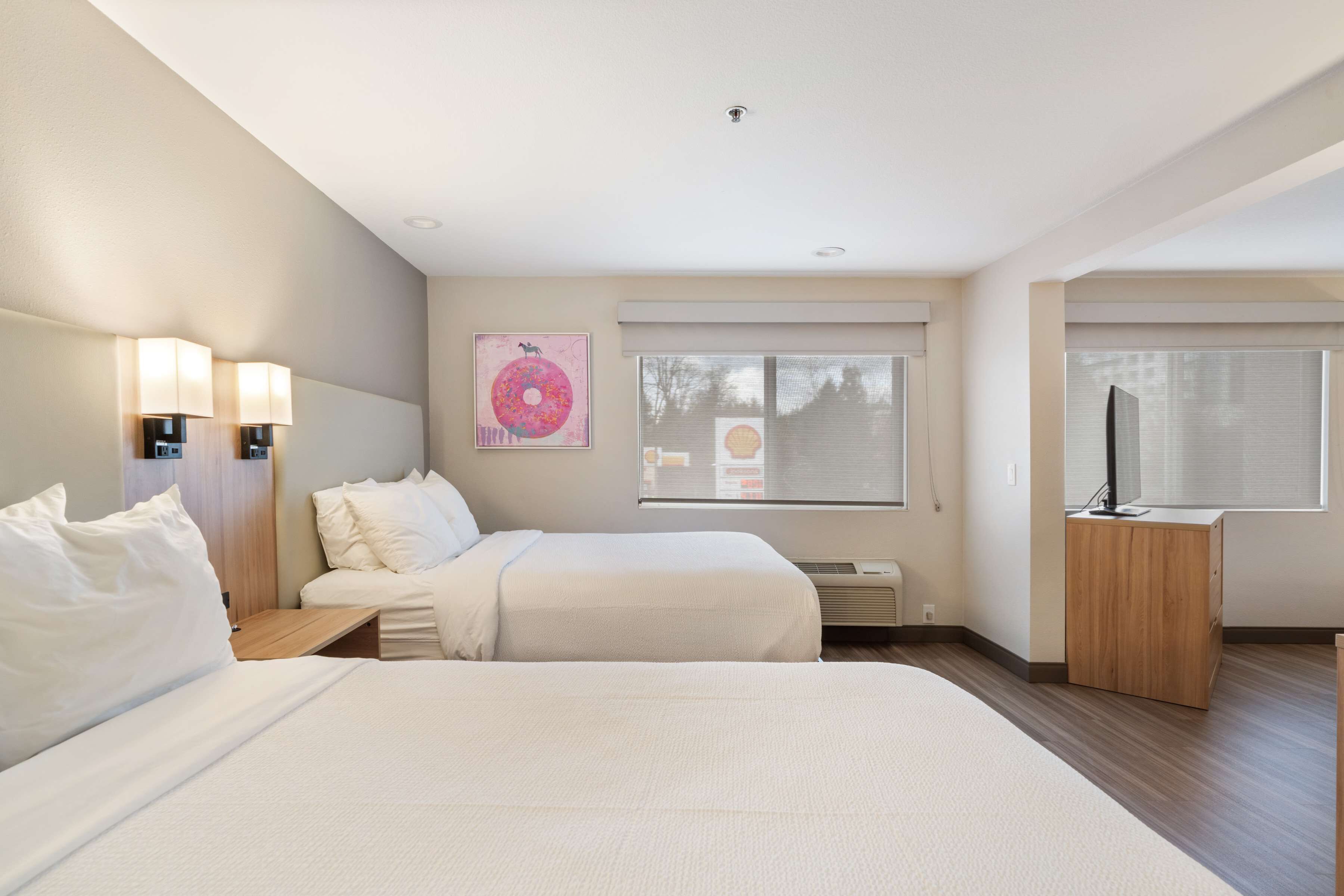 Premium bedding, pillow-top beds, desk, laptop workspace