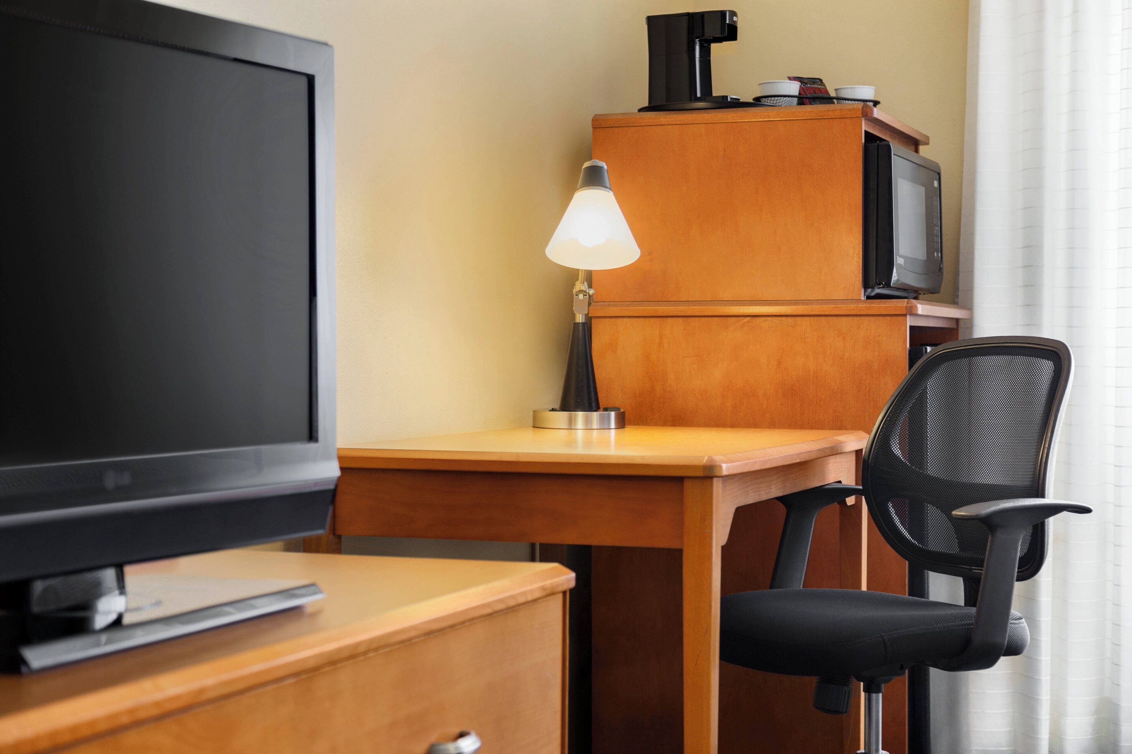 premium bedding, pillow-top beds, desk, laptop workspace