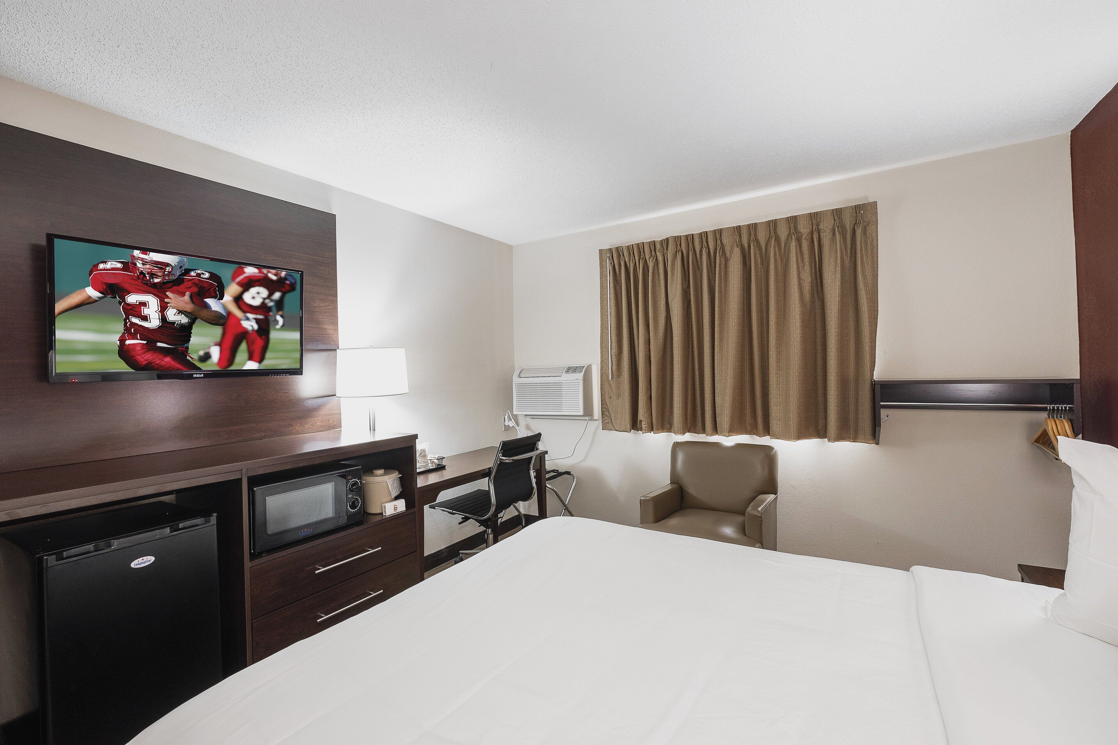 deluxe room, 1 queen bed, accessible, non smoking | desk, iron/ironing board, free cots/infant beds, free wifi