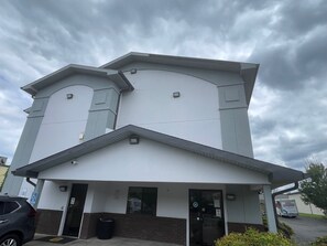 A two-story building with a flat roof and a large entrance. - Super 8 by Wyndham Danville VA (Danville)