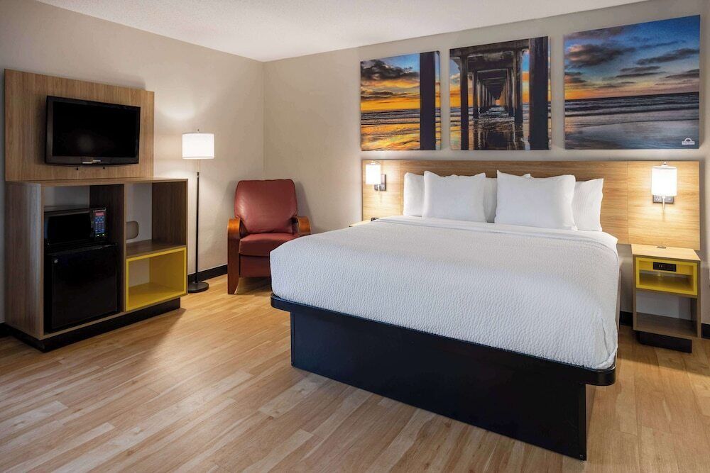 Premium bedding, desk, laptop workspace, iron/ironing board