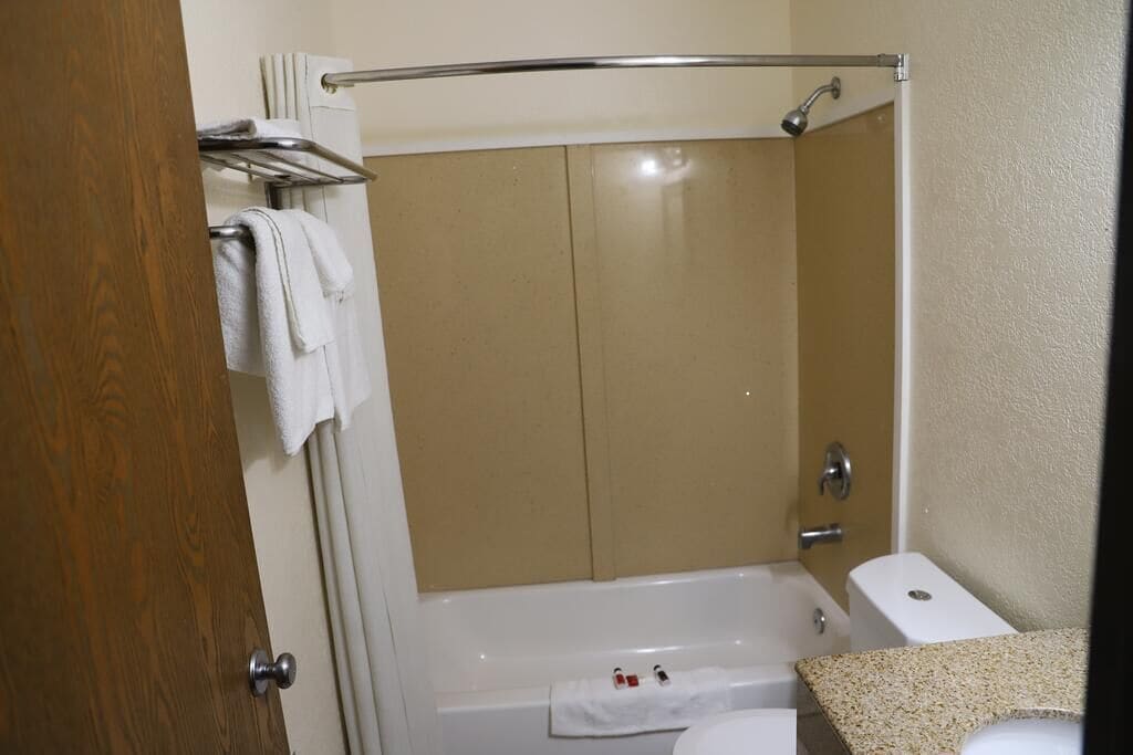 combined shower/bathtub, hair dryer, towels, soap
