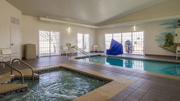 Indoor pool, pool umbrellas, pool loungers