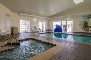 Indoor pool, pool umbrellas, pool loungers