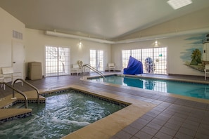 Indoor pool, open 8:00 AM to 11:00 PM, pool umbrellas, pool loungers