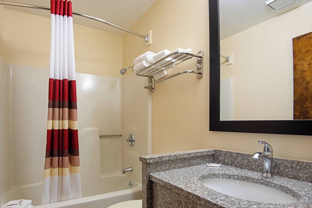 Combined shower/tub, hair dryer, towels, soap