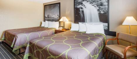A hotel room with two beds, a chair, a nightstand, and two wall-mounted lamps.