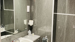 A modern bathroom with a large sink, mirror, and toilet. - Britannia Hotel Newcastle Airport (Newcastle-upon-Tyne)