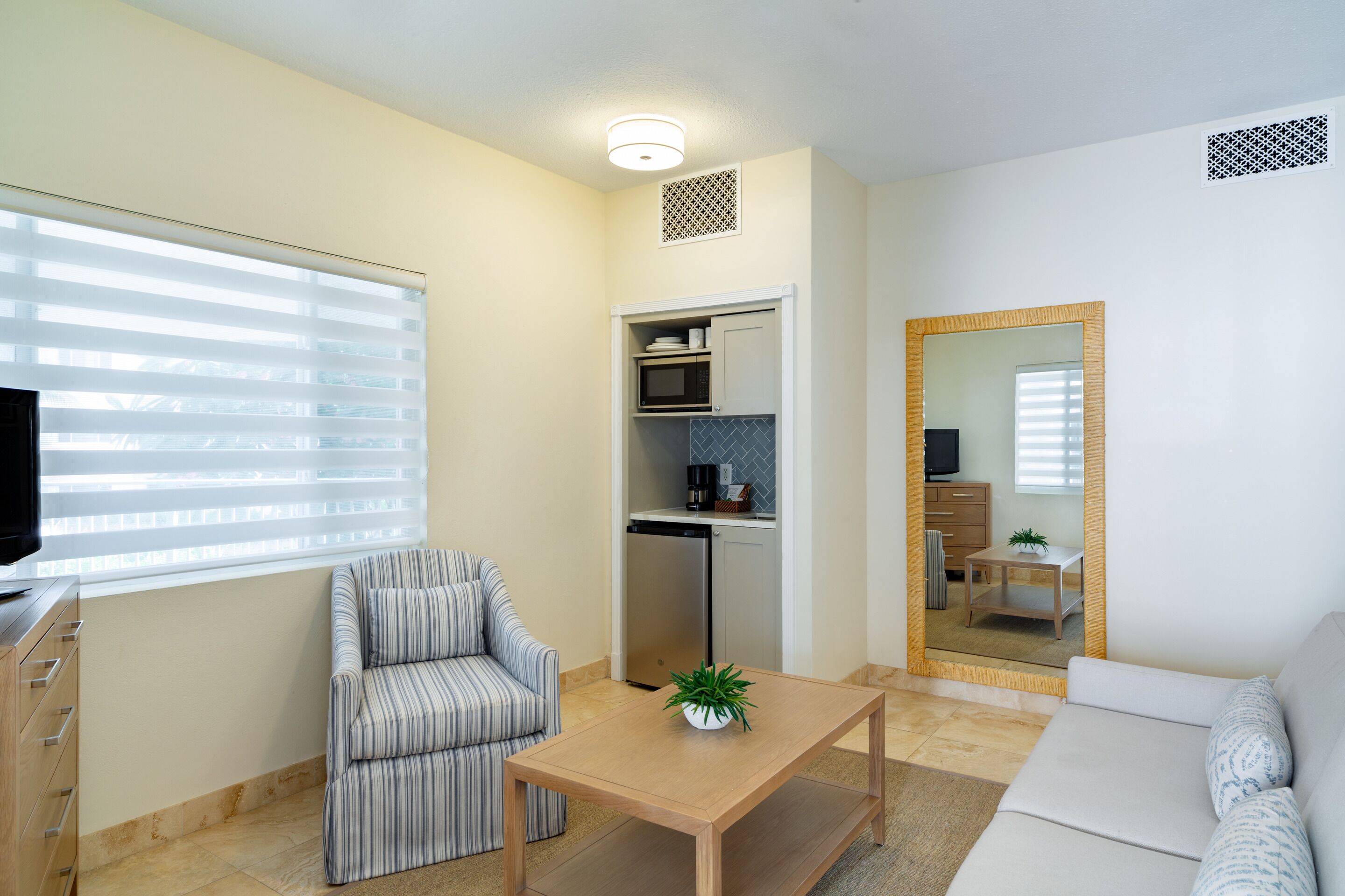 junior suite (courtyard) | in-room safe, desk, blackout curtains, iron/ironing board