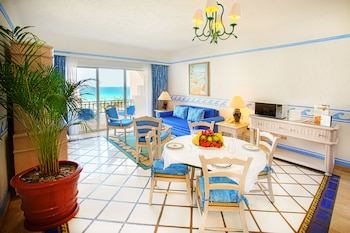 Enjoy ocean views from the balcony, featuring a dining area with a table for two, comfortable seating, and a sofa. at Pueblo Bonito Los Cabos Blanco - All Inclusive