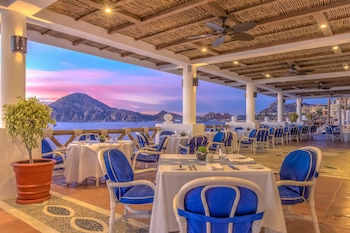 Enjoy al fresco dining with a view of the sea and mountains from this outdoor dining area. at Pueblo Bonito Los Cabos Blanco - All Inclusive