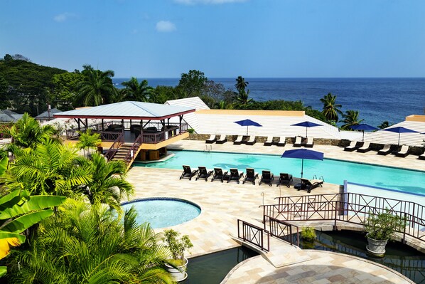 Outdoor pool, open 6 AM to 6 PM, pool umbrellas, pool loungers