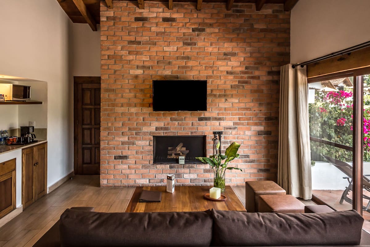 superior suite | living area | 40-inch smart tv with cable channels, tv, fireplace