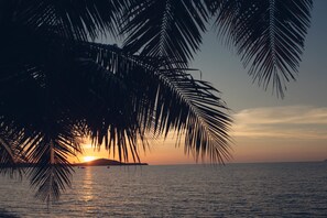 On the beach, sun-loungers, beach umbrellas, beach towels
