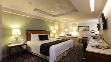 Junior Suite, 1 King Bed (Interior) | Premium bedding, minibar, in-room safe, desk