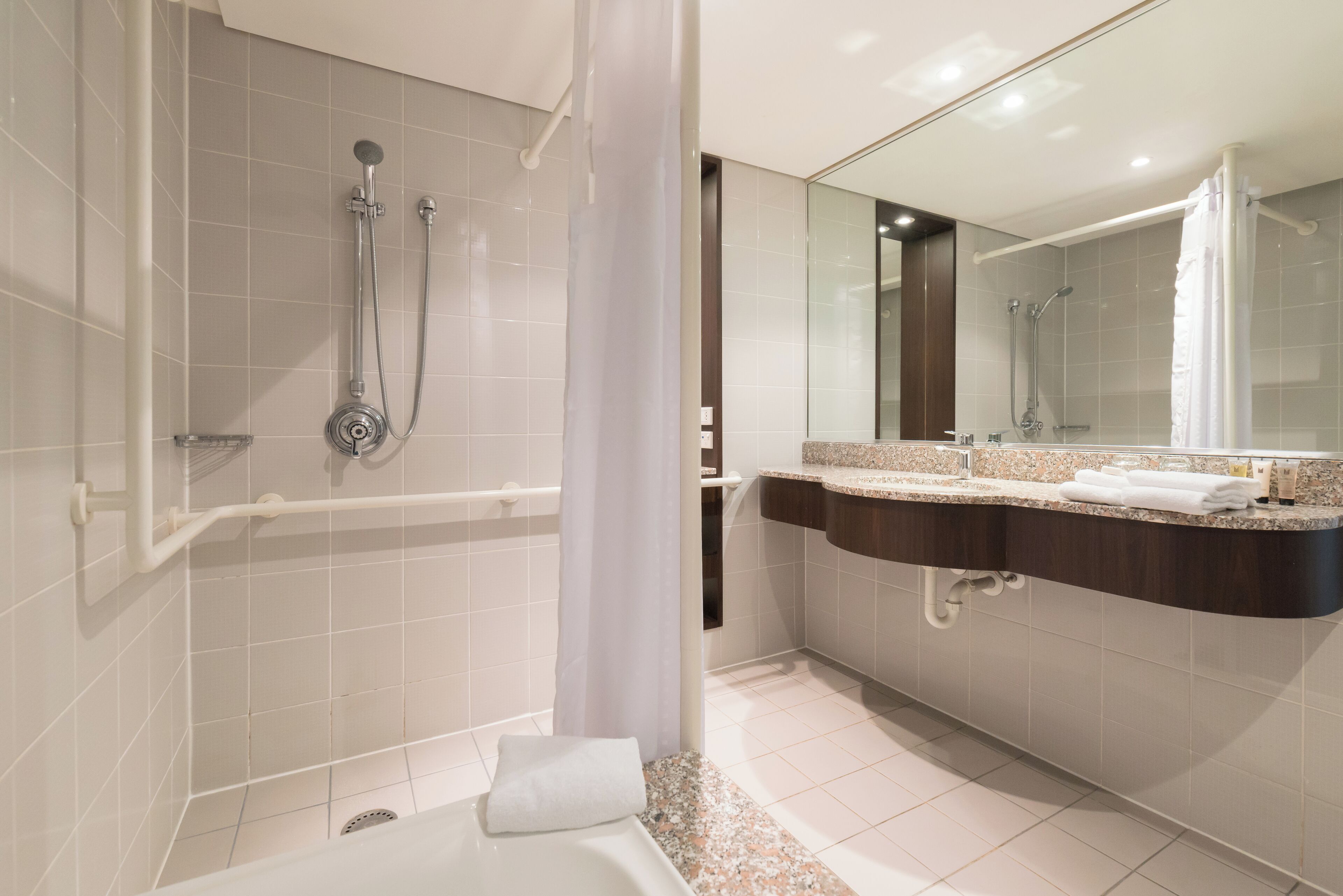 separate bathtub and shower, eco-friendly toiletries, hair dryer, towels