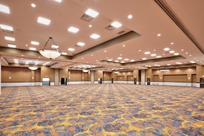 A large conference room with a patterned carpet, recessed lighting, and wooden paneling. - Hampton Inn & Suites Dallas-Mesquite (Mesquite)