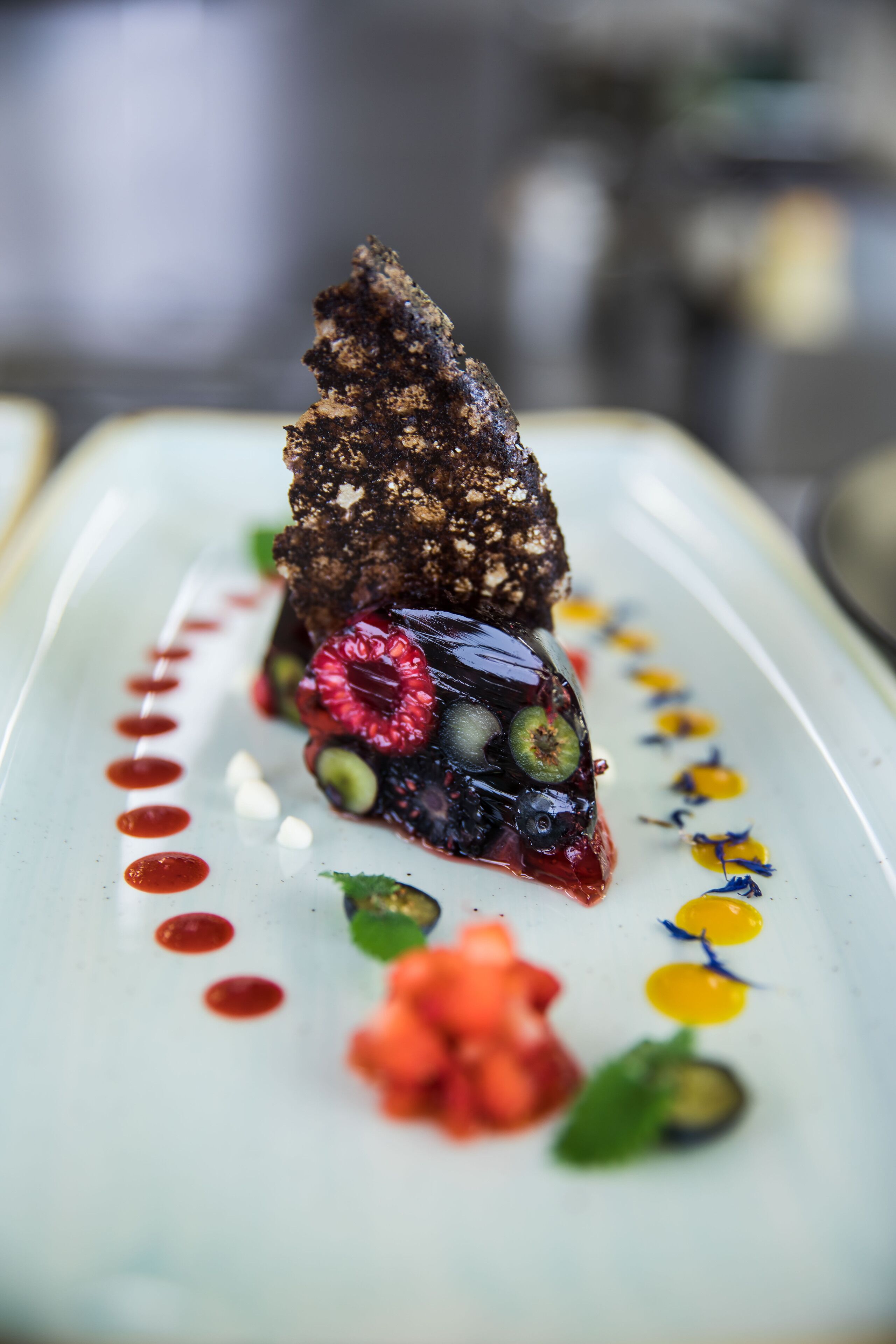 A dessert on a plate with a decorative pattern.