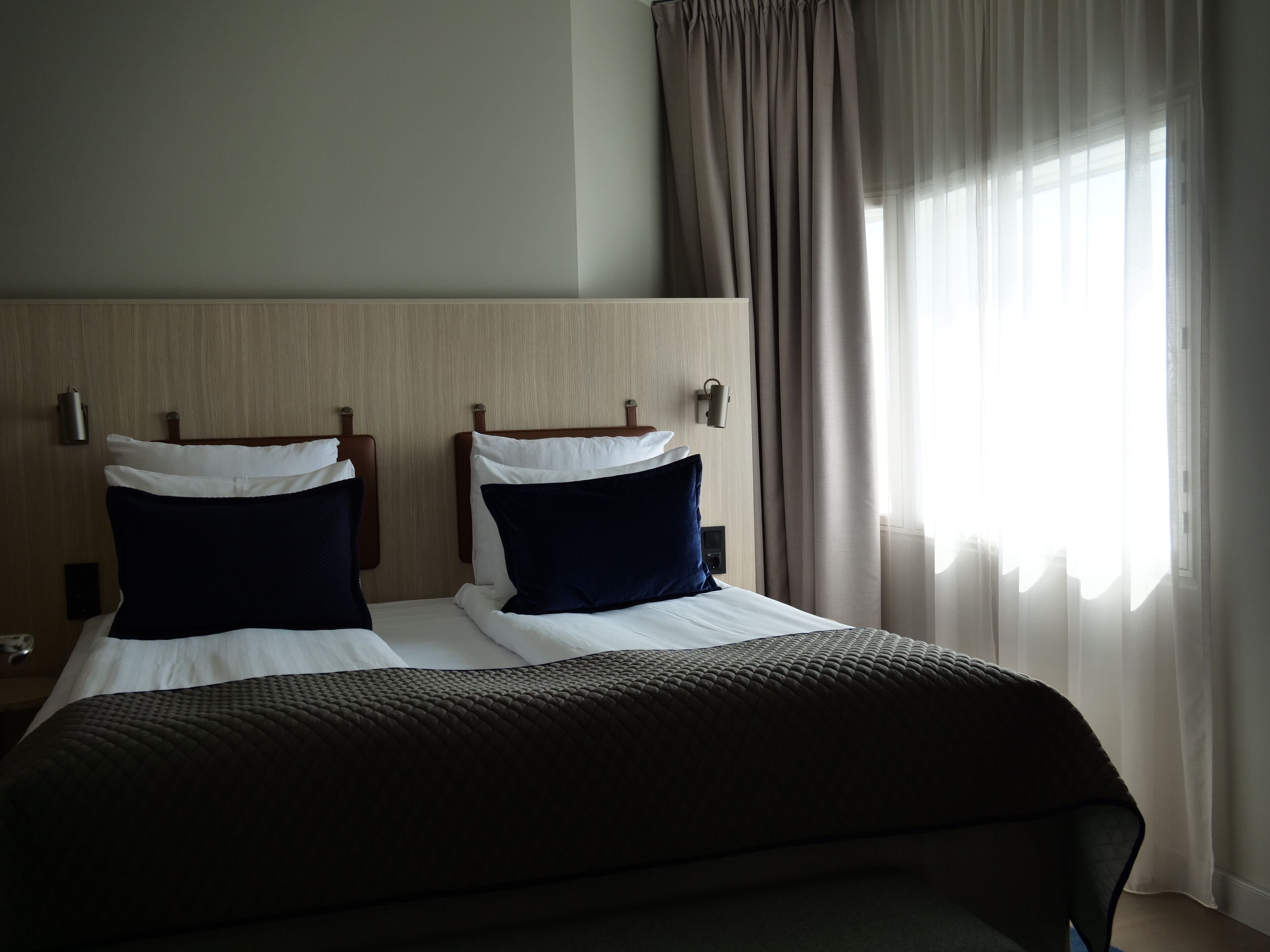 hypo-allergenic bedding, desk, laptop workspace, blackout curtains