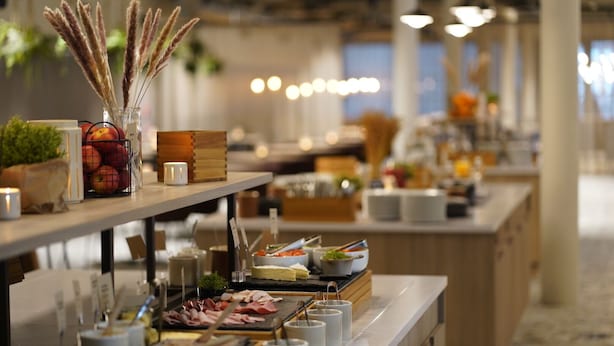 A buffet setup with various food items and condiments. - Quality Hotel Arlanda XPO (Arlandastad)