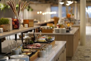 A buffet setup with various food items and condiments. - Quality Hotel Arlanda XPO (Arlandastad)