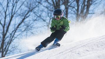 A person skiing down a snowy slope.