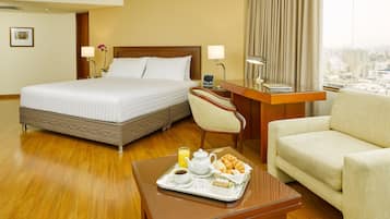 Premium Suite, 1 King Bed | Living area | 32-inch LCD TV with cable channels, TV