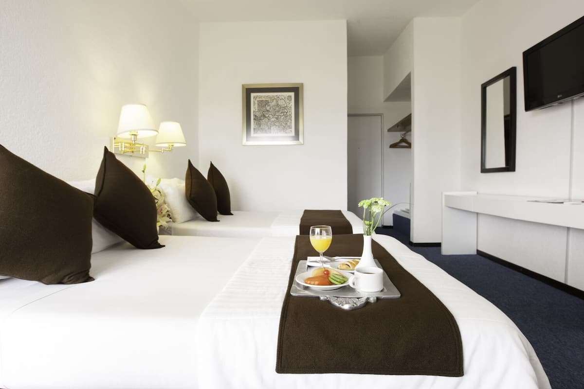 Premium bedding, down duvets, in-room safe, desk