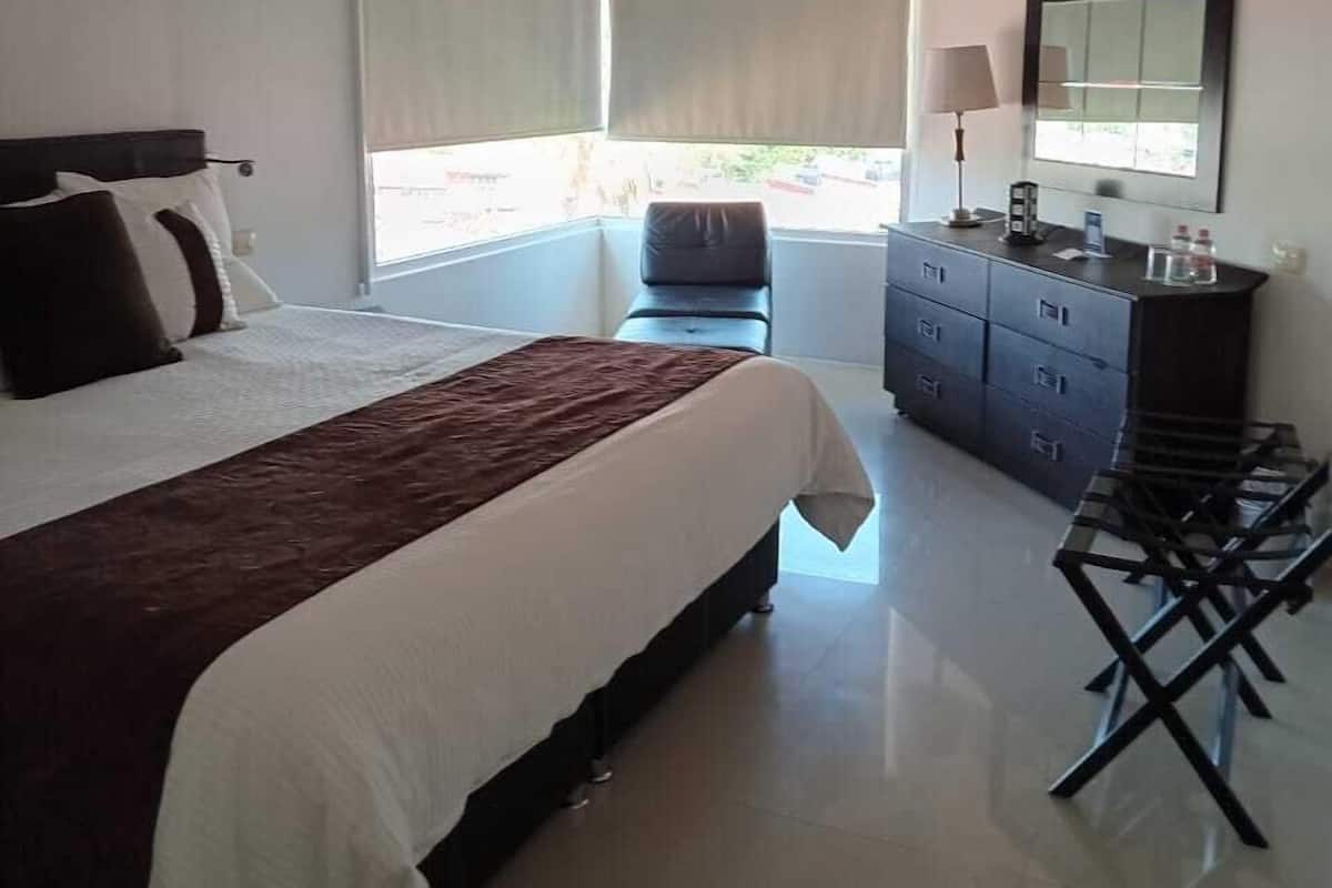 Premium bedding, down duvets, in-room safe, desk