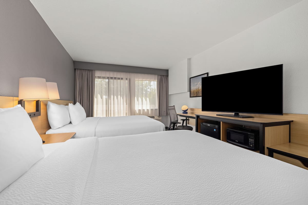 Deluxe Room, 2 Queen Beds, Mountain View | Pillowtop beds, desk, laptop workspace, rollaway beds