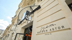 The exterior of Maison Astor in Paris, featuring ornate architectural details and a prominent entrance. - Maison Astor Paris, Curio Collection by Hilton (Paris)