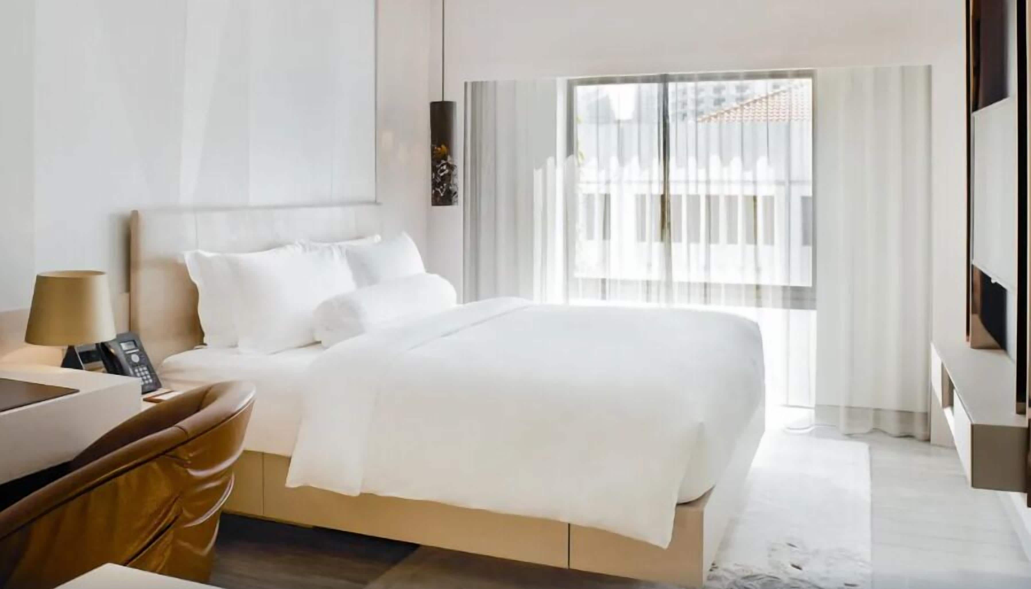 Egyptian cotton sheets, premium bedding, free minibar, in-room safe