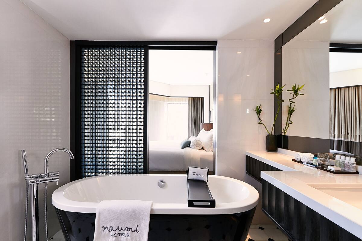 oasis room | bathroom | shower, rainfall showerhead, designer toiletries, hair dryer